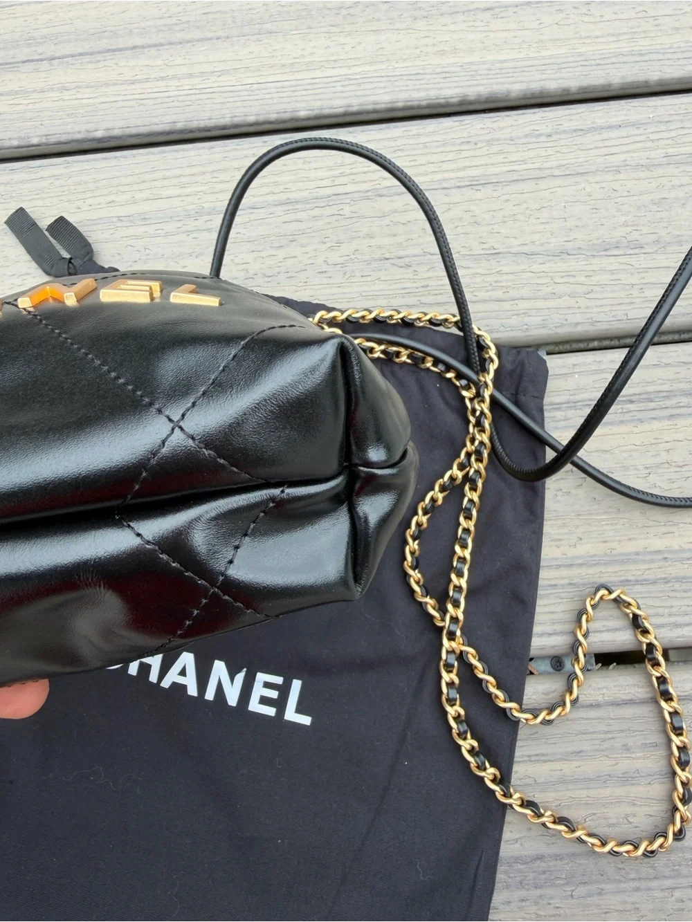 CHANEL Black Quilted Leather Drawstring Crossbody with Gold Chain